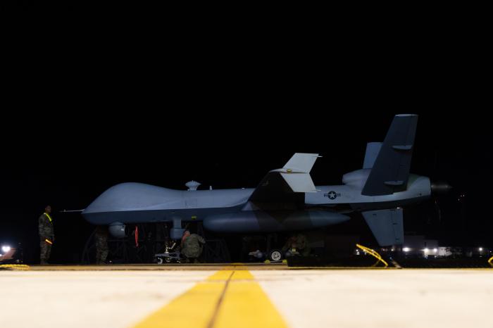 Maintenance personnel assigned to the USAF's 319th ERS prepare to push an MQ-9A Reaper into a hardened aircraft shelter shortly after the UCAV arrived at Kadena Air Base in Okinawa, Japan, on October 13.