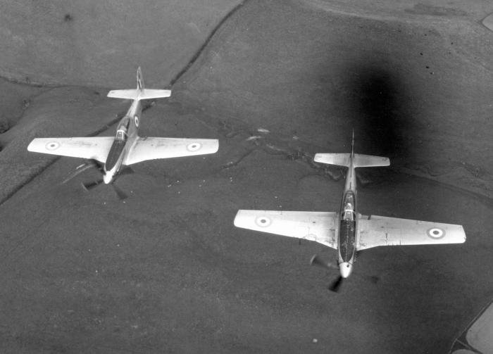NZ2423 in formation with NZ2402 during their RNZAF service, photographed from Avenger NZ2504.
