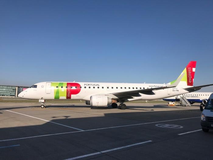 A Portugalia Airlines’ E190-E1 in the colours of TAP Express, the Portuguese flag carrier’s regional operation, visits an unusually sunny London City Airport