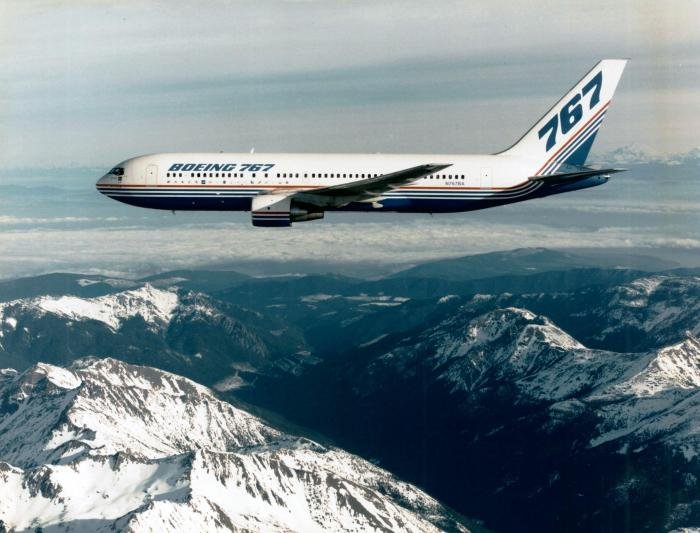The prototype Boeing 767-200 with the flags of its customers lined up under the windows of the cabin. By 2023 around 75 customers had ordered variants of the aircraft.