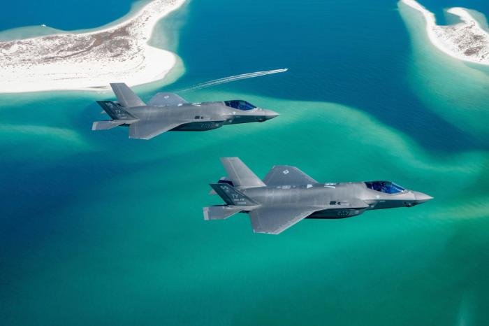 F-35A Lightning IIs assigned to the 325th FW's 95th Fighter Squadron 'Boneheads' at Tyndall AFB, Florida, fly over the Gulf of Mexico during Exercise Checkered Flag 24-1 on November 7.