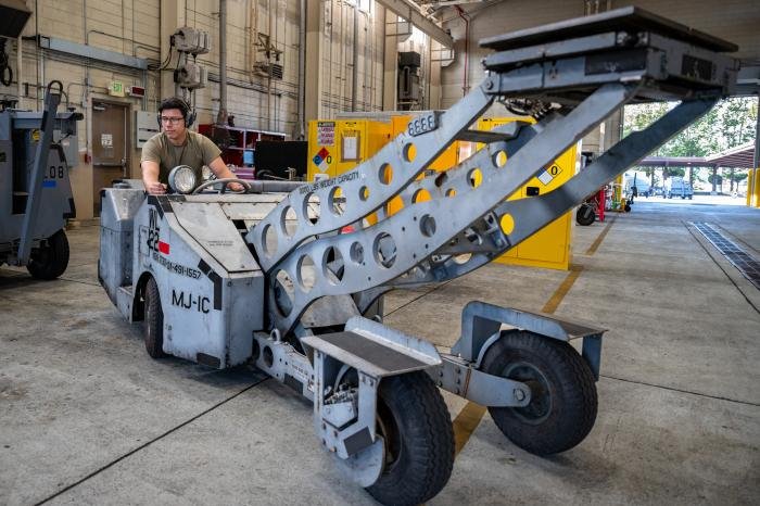 An aerospace ground equipment (AGE) technician conducts a routine inspection on a bomb lift truck at Osan Air Base. By inspecting and maintaining equipment, AGE technicians reduce aircraft downtime, ensuring readiness for rapid aircraft deployment.