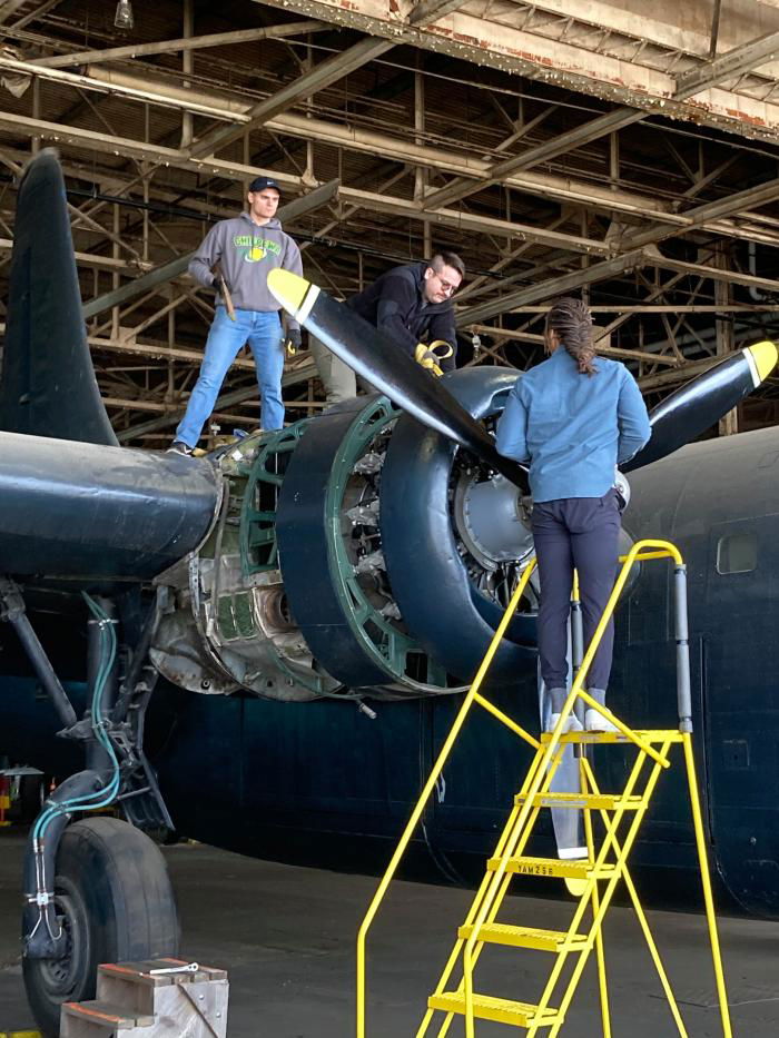 Personnel at work on the Yankee Air Museum's Privateer