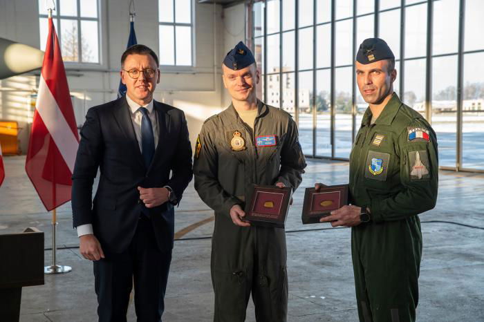 The Belgian and French detachment commanders are presented with tokens of appreciation from the Lithuanian Ministry of Defence