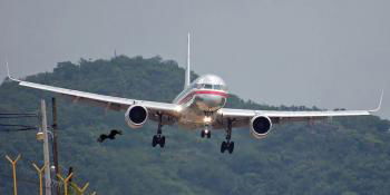 Much like the bird of prey in the foreground, the Boeing 757 approaches Toncontín with leading edge slats and flaps extended as it swoops down the hillside on short final.