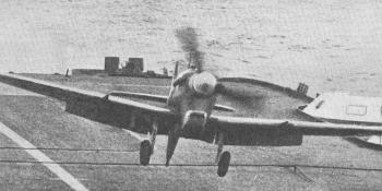 FORMIDABLE FIGHTER . – A Supermarine Seafire I, with arrestor hook extended, landing on the deck of H.M.S. Formidable during the operations at Salerno. The ships reported to have taken part in this action were the 23,000-ton carriers Illustrious and Formidable, covered by the Nelson and Rodney, and the escort carriers Attacker, Battler, Hunter, Stalker, and Unicorn, covered by light cruisers and destroyers.