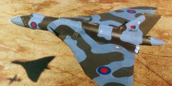 6 Epitomising the type’s low-level role, the last Vulcan built, B2 XM657, formates with a cameraship for a photo sortie. This aircraft was conversely the first to receive, in 1979, the new wrap-around camouflage. CROWN COPYRIGHT