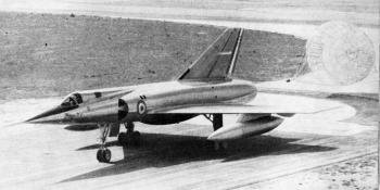 Only the bogie undercarriage units and the longer tandem cockpit enclosure provide immediately distinguishing features between the Mirage IV, seen here with its half-ribbon brake parachute deployed, and the smaller Mirage III fighter.