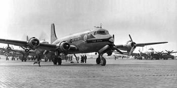 C-54 Skymasters on turn-around between airlift sorties, with C-54G 45-532 of the Pacific Division, Military Air Transport Service, in the foreground. KEY COLLECTION